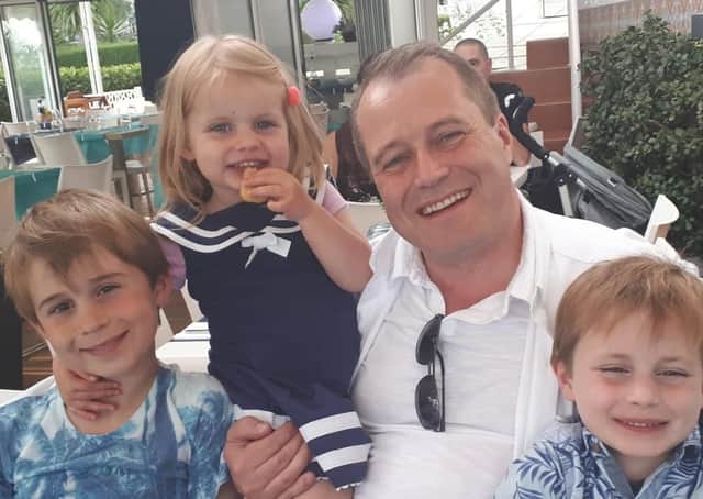 Andrew McGinley, with his children Conor, Carla and Darragh.