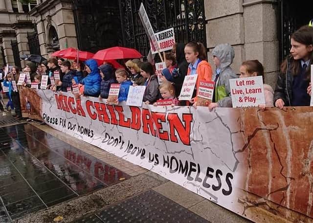 Children who live in houses affected by mica protest outside Dail Eireann.