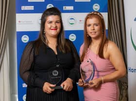 SISTERS OF MERCY . . . Joint winners of HCCI Carer of the Year award, Co Derry sisters Lauren and Chloe Kelly from Connected Health, pictured receiving their award during a ceremony at the Shelbourne Hotel in Dublin on Thursday, October 21. (Naoise Culhane)