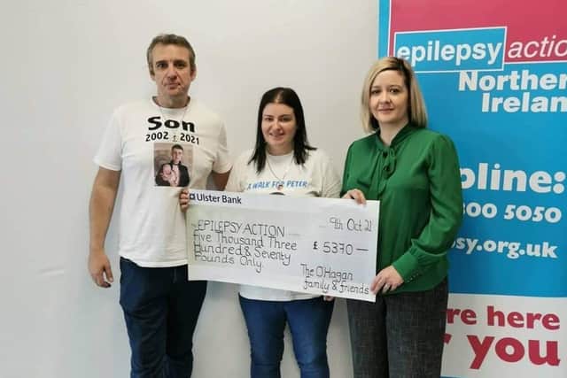 The family and friends  of the late Peter O’Hagan from Shantallow gather to present the money they raised through fundraising initiatives to Epilepsy Action  NI.