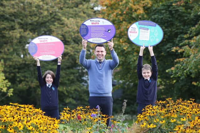 Rosemount Primary School, Derry pupils Saoirse Schlindwein (10) and her brother Franz (11) with school numeracy co-ordinator Conor Quinn, celebrate Maths Week 2021.