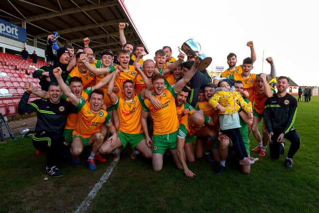 Desertmartin players celebrate their victory over Sean Dolans in the Junior Football Championship Final in Celtic Park on Saturday afternoon.( Photo: George Sweeney)