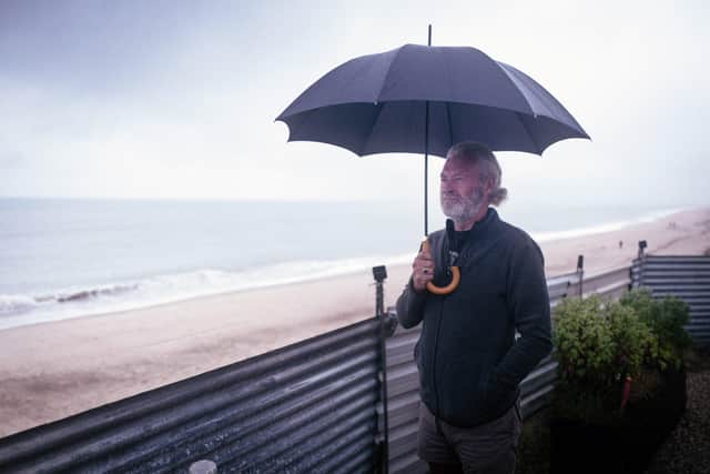 On the cliff edge from his home in Hemsby in Norfolk Lance Martin looks out to sea