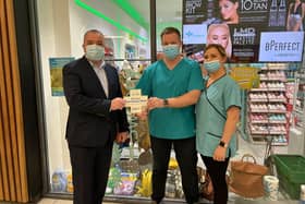 Pictured is SDLP Councillor Brian Tierney visiting a local pharmacy.