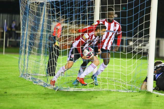 Derry City's Danny Lafferty rushes into the net to get the ball back, after he levelled things at the RSC. Picture by Kevin Moore/mci