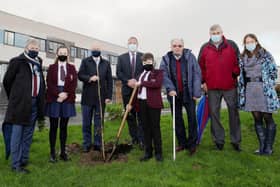 Professor Liam Maguire (UU), Kayla McDermott (Foyle College pupil), Professor Paul Bartholomew (UU), Patrick Allen (Principal, Foyle College), Kelvin McDermott (pupil), Dr Robert Murtland, William Lynn (teacher, Foyle College) and Nicole Sloane (teacher, Foyle College), with the newly plated tree at Foyle College.