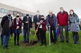 Professor Liam Maguire (UU), Kayla McDermott (Foyle College pupil), Professor Paul Bartholomew (UU), Patrick Allen (Principal, Foyle College), Kelvin McDermott (pupil), Dr Robert Murtland, William Lynn (teacher, Foyle College) and Nicole Sloane (teacher, Foyle College), with the newly plated tree at Foyle College.