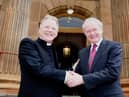 2011... Rev. David Latimer and Martin McGuinness outside First Derry Presbyterian.