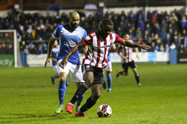 Derry City's James Akintunde shields the ball from Finn Harps' Ethan Boyle. Picture by Kevin Moore/MCI