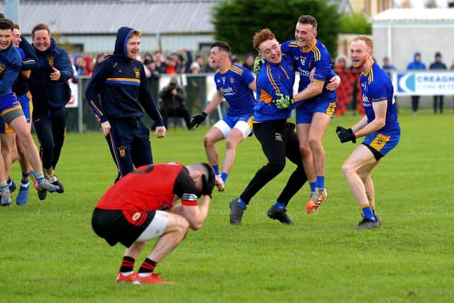 Steelstown players celebrate their victory over Greenlough in the Intermediate Football Championship Final in Ballymaguigan on Saturday afternoon last.  Photo: George Sweeney. DER2144GS – 030