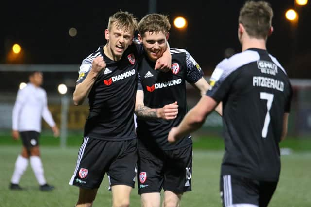 Derry City's Ciaron Harkin and Will Fitzgerald (No 7) celebrate with Jamie McGonigle after his stunning second goal. Picture by Kevin Moore/mci