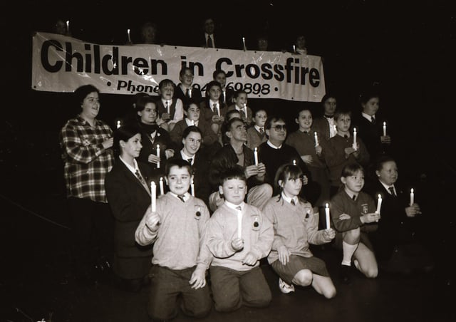 Gerry Anderson and Richard Moore with local school children launching Children in Crossfire’s ‘A Flicker of Hope’ candlelight appeal in 1996.