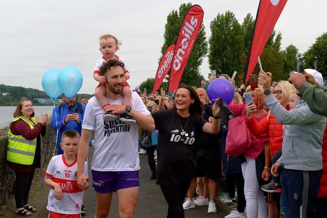 Danny Quigley with his partner Eimear and sons Jack and Malachi after he completed 10 Ironman Triathlons in 10 days in memory of his father Colm.