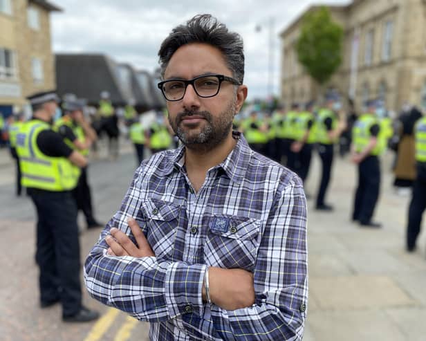 Sathnam with police at Batley demonstration