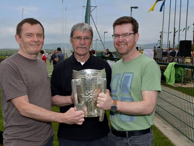 Seán Mellon with Paul Burke and Gerard Finnigan with the McCarthy Cup at the official unveiling of the Na Magha clubhouse in 2016.