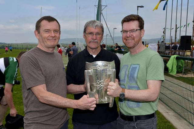 Seán Mellon with Paul Burke and Gerard Finnigan with the McCarthy Cup at the official unveiling of the Na Magha clubhouse in 2016.
