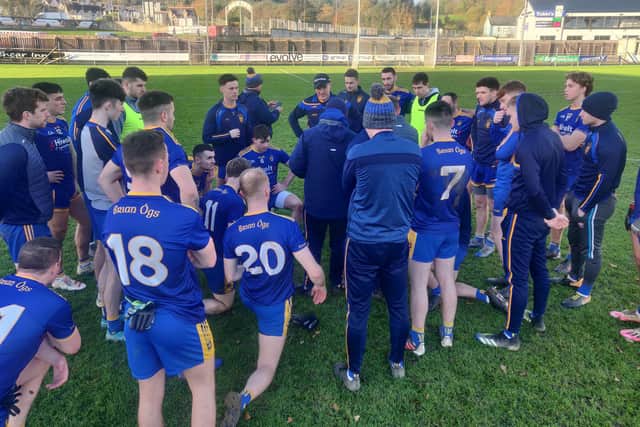 Steelstown manager Hugh McGrath talks to his players following Saturday's victory over Cloughaneely in Letterkenny.
