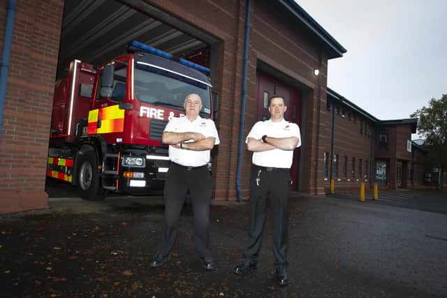 John and son Noel pictured outside Crescent Link Fire Station on his last day of service.