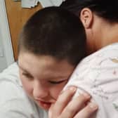Ben O'Neill, 13, hugs his mother Ciara Gilliland