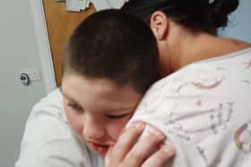 Ben O'Neill, 13, hugs his mother Ciara Gilliland