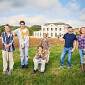 The Beeny family with the house behind them