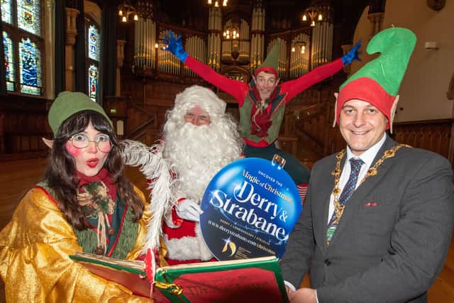 Derry City and Strabane District Council Mayor Alderman Graham Warke attempts to discover wether he is on Santaâ€TMs naughty or nice list at the launch of this years programme of events. Picture Martin McKeown. 09.11.21