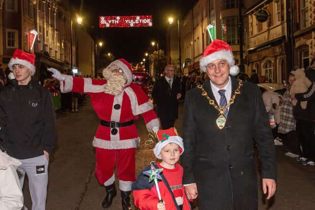 Mayor of Derry City and Strabane District Council, Alderman Graham Warke, with his son Ollie and Santa Claus at the official lights switch on in Derry.