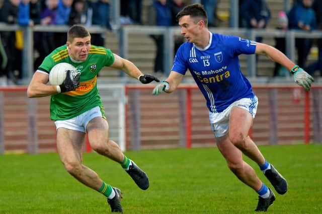Scotstown’s Shane Carey moves in to tackle Glen’s Ciaran McFaul in Celtic Park on Sunday. (Photo: George Sweeney)