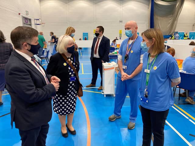 Robin Swann meeting local vaccination healthcare staff previously.