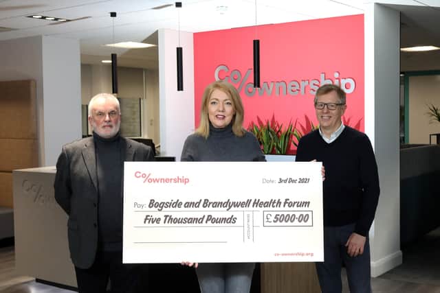 Pictured l-r David Little Chair at Co-Ownership, Mary Breslin of Bogside and Brandywell Health Forum and Mark Graham, Chief Executive at Co-Ownership