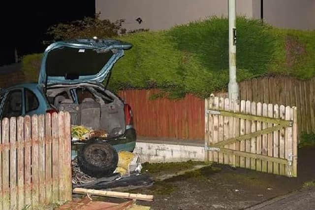 2019: The vehicle where the Command Wire Initiated Improvised Explosive Device was located, parked in a driveway.