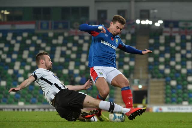 New Derry City signing Cameron Dummigan pictured in action for Dundalk against Linfield's Mathew Clarke in the Unite the Union Cup at Windsor Park.