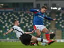 New Derry City signing Cameron Dummigan pictured in action for Dundalk against Linfield's Mathew Clarke in the Unite the Union Cup at Windsor Park.