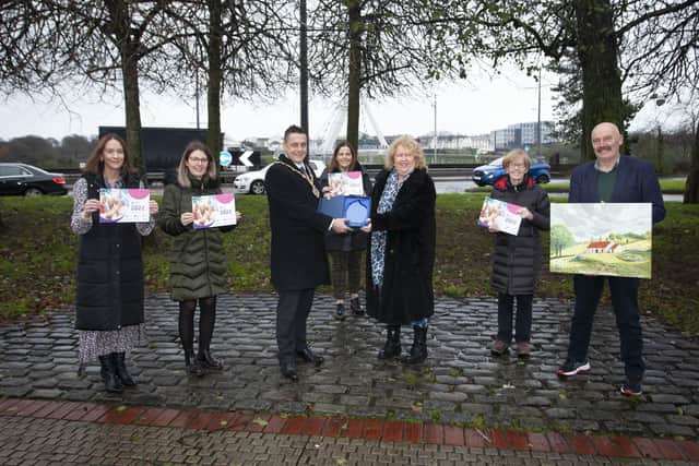 The Mayor of Derry City and Strabane District Council, Graham Warke presenting an award to Pearl Evans, winner of 'Your Happy Place' Calendar competition (sponsored by DCSDC) at the Guildhall on Thursday afternoon. Included from left are Heather Hamilton, Public Health Authority, Debbie Hunter, Western Health and Social Care Trust, Ciara Burke, DCSDC, Eileen Diver and Declan Devine, runners-up. (Photos: Jim McCafferty Photography)