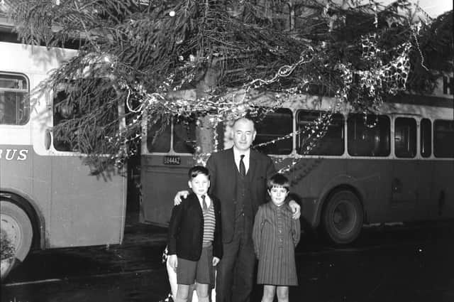 December 1969... Don Browne, aged 10, with Derry Development Commission vice-chairman Stephen McGonagle and the little girl he is anxious to track down.