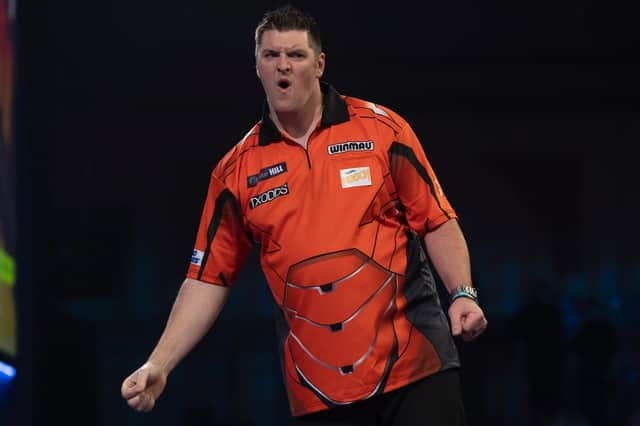 Daryl Gurney celebrates after his second round win over Ricky Evans, at the William Hill World Darts Championships, at Alexandra Palace. Picture by Lawrence Lustig