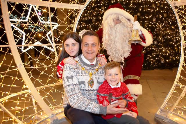 IT’S CHRISTMAS TIME... Mayor Graham Warke with his children, Katelyn and Ollie, and Santa Claus.