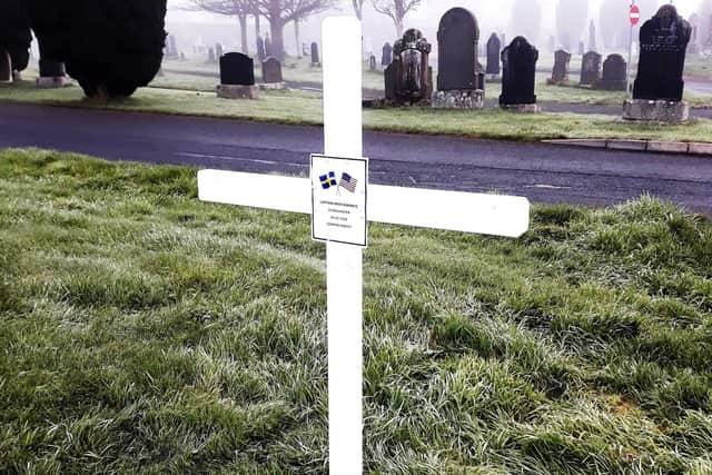The white cross erected at Capt. Kokeritz's grave.