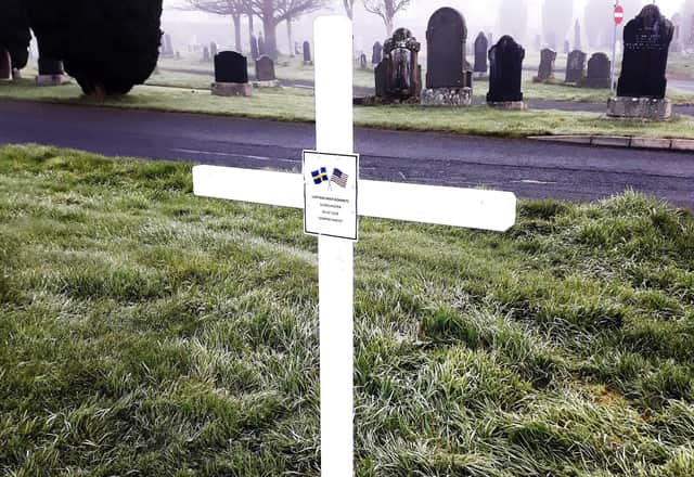 The white cross erected at Capt. Kokeritz's grave.