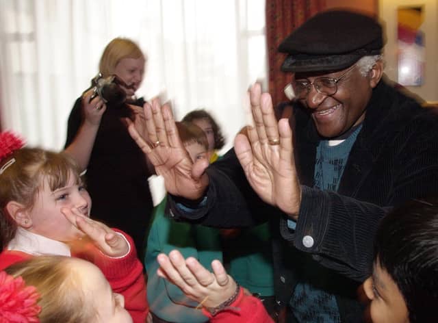 PACEMAKER BELFAST, 5/11/2001:  Archbishop Desmond Tutu from South Africa chats with schoolgirls from Holy Cross School in Belfast.  Archbishop Tutu was in Belfast to address a human rights conference organised by the Committee for the Administration of Justice.  PICTURE BY STEPHEN DAVISON