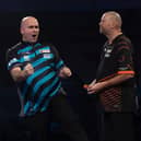 Rob Cross celebrates his win over Raymond van Barneveld in the clash of former winners in the William Hill World Darts Championship second round.