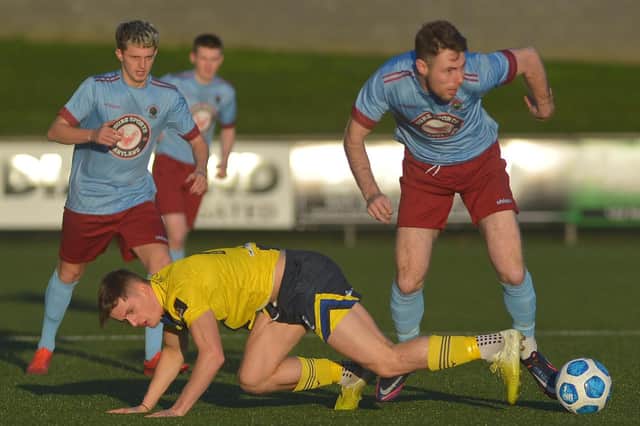 Institute midfielder Shaun Doherty takes the ball off Newry City's John McGovern, during Saturday's draw, at the Ryan McBride Brandywell Stadium. Picture by George Sweeney.