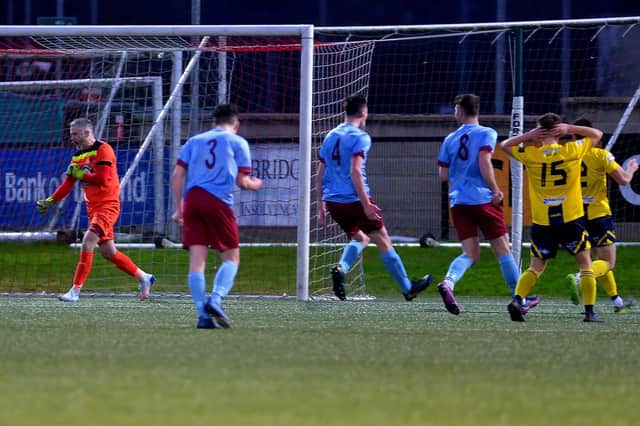 Institute goalkeeper John Connolly punches the air as he celebrates keeping out Newry City’s Daniel Hughes’ second half penalty. Picture by George Sweeney