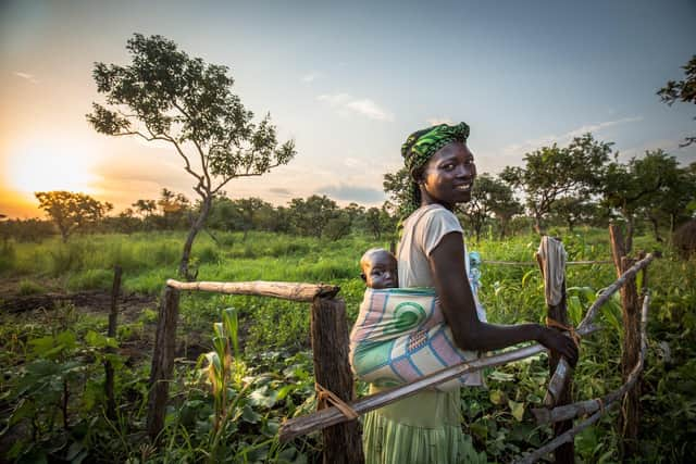 Yaka Lucia, in the beginnings of her Permagarden with her baby Rosa. ©Sarah Fretwell