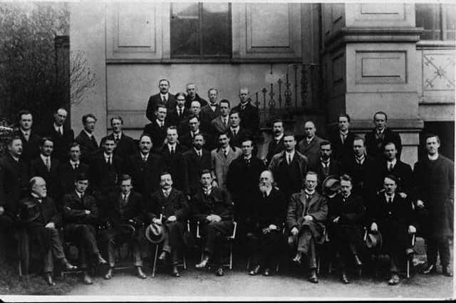 Joseph O’Doherty, pictured in the second row alongside members of the First Dáil in 1919. 1st row: L. Ginell, Michael Collins (leader of the Irish Republican Army), Cathal Brugha, Arthur Griffith (founder of Sinn Féin), Eamon de Valera (president of the Irish Republic), Count E. MacNeill, William Cosgrave and E. Blythe; 2nd row: P. Maloney, Terence McSwiney (Lord Mayor of Dublin), Richard Mulcahy, J. O’Doherty, J. O’Mahony, J. Dolan, J. McGuinness, P. O’Keefe, Michael Staines, McGrath, Dr. B. Cussack, L. de Roiste, W. Colivet and the Reverend Father Michael O’Flanagan (vice-president of Sinn Fein); 3rd row: P. War, A. McCabe, D. Fitzgerald, J. Sweeney, Dr. Hayes, C. Collins, P. O’Maillie, J. O’Mara, B. O’Higgins, J. Burke and Kevin O’Higgins; 4th row: J. McDonagh and J. McEntee.