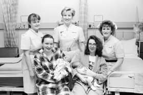 Sinead McGlinchey, seated left, from Epworth Street, with her daughter, Nina, born 11.47am on New Year’s Day 1997 weighing 7lb. 13 oz., and Marcia McFeely, from Liscloon Drive, with her son Aaron, born at 6.15am on New Year’s Day weighing 9lb. Included, from left, Staff Midwives Beverly Crothers and Moira Blee and Ward Sister Geraldine Sloane.