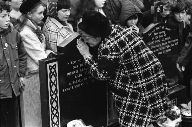 1973... Kathleen Kelly, mother of Michael Kelly (17), pictured at his grave on the first anniversary of the massacre.