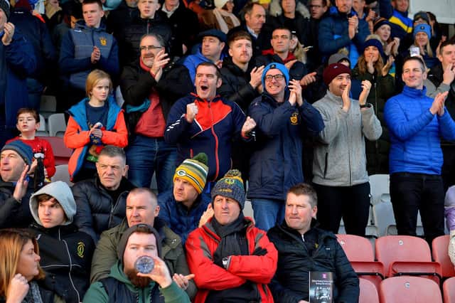 Steelstown chairman, Paul O'Hea (extreme right in blue coat) pictured cheering on the Brian Ogs during their Ulster semi-final victory over Butlersbridge
