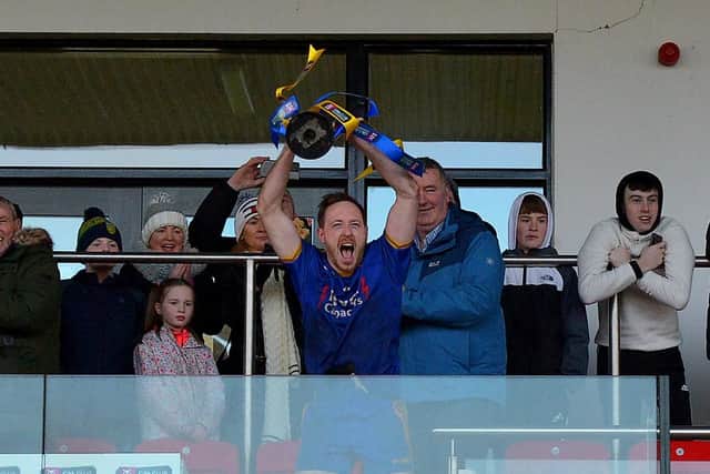 Steelstown captain lifts the Ulster GAA Football Intermediate Club Championship trophy at Owenbeg. (Photo: George Sweeney)