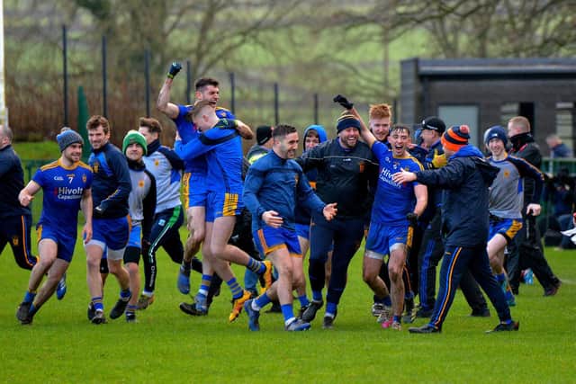 Steelstown players celebrate their Ulster GAA Football Intermediate Club Championship Final win over Moortown with manager Hugh McGrath at Owenbeg. (photo: George Sweeney)